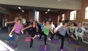 Teachers of St Agnes Primary Port Macquarie in a group yoga pose for Retreat Day