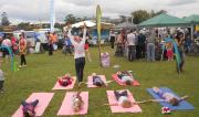 Green Day Out 2011 kids practing yoga at the markets near the river.