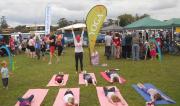 Green Day Out 2011 kids practing yoga at the markets near the river.