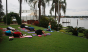 Ladies practicing yoga on the banks of the river for the 'Me Time' Event
