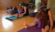 Students in Caterpillar (Yin) Pose at a Yin/Yang Retreat by Yoga Shala.