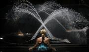 Martine Ford of Spirit Yoga meditating in front of the fountain.